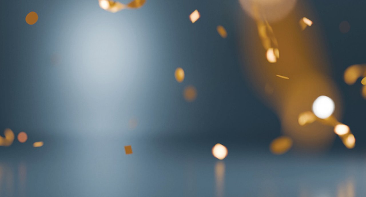 Gold glitter on a grey background