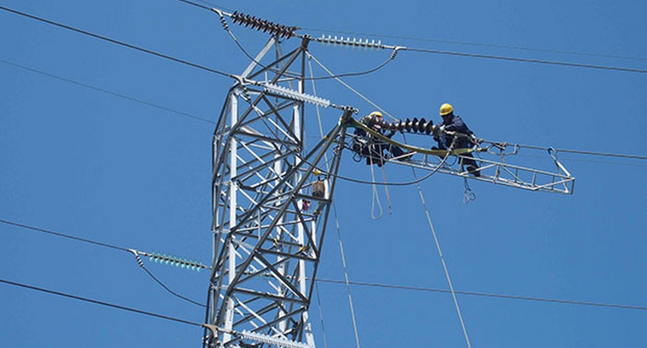 Man on an electricity pylon