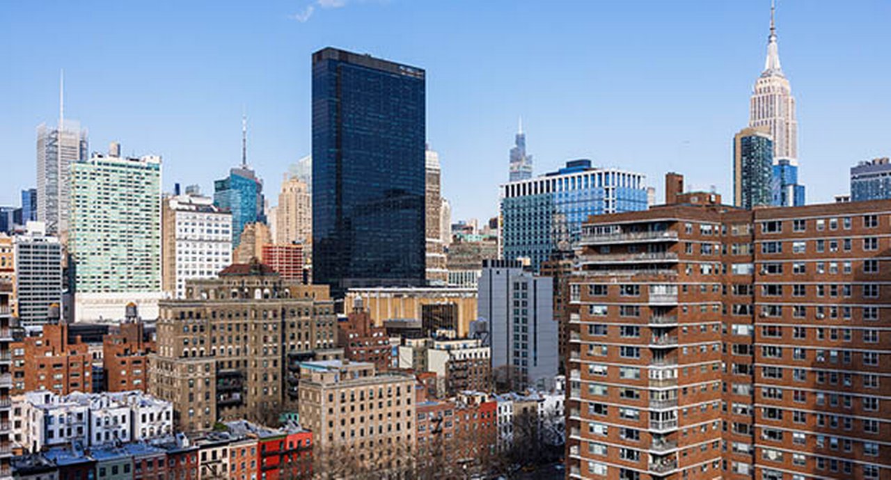 Empire State Building Towers Over Midtown Historic Brownstones Meet Modern Skyscrapers Across New York City Skyline