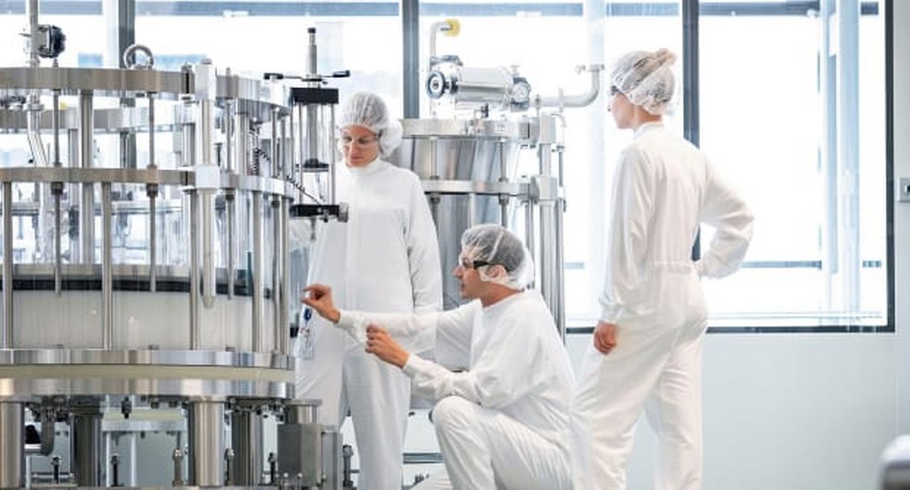 Lab workers working with lab equipment